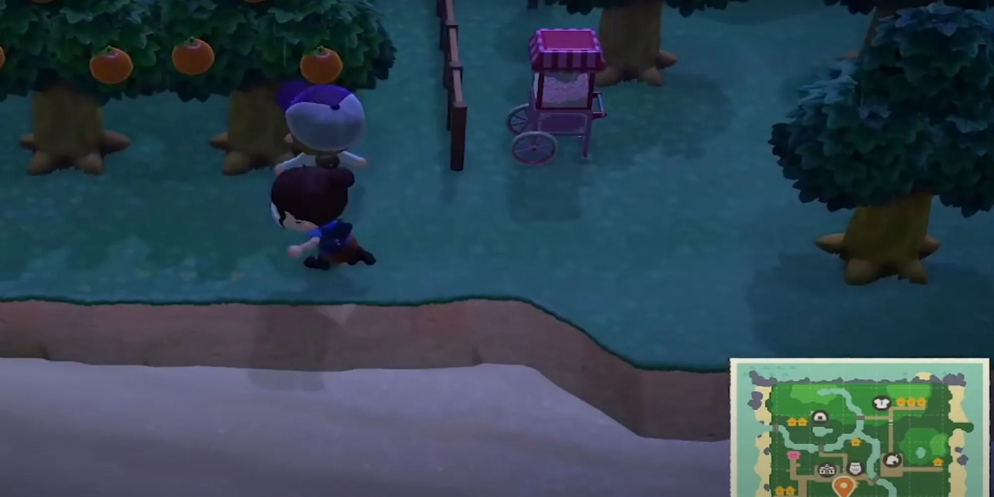 Nhân vật người chơi chạy qua vườn táo trĩu quả trên hòn đảo cá nhân trong Animal Crossing: New Horizons