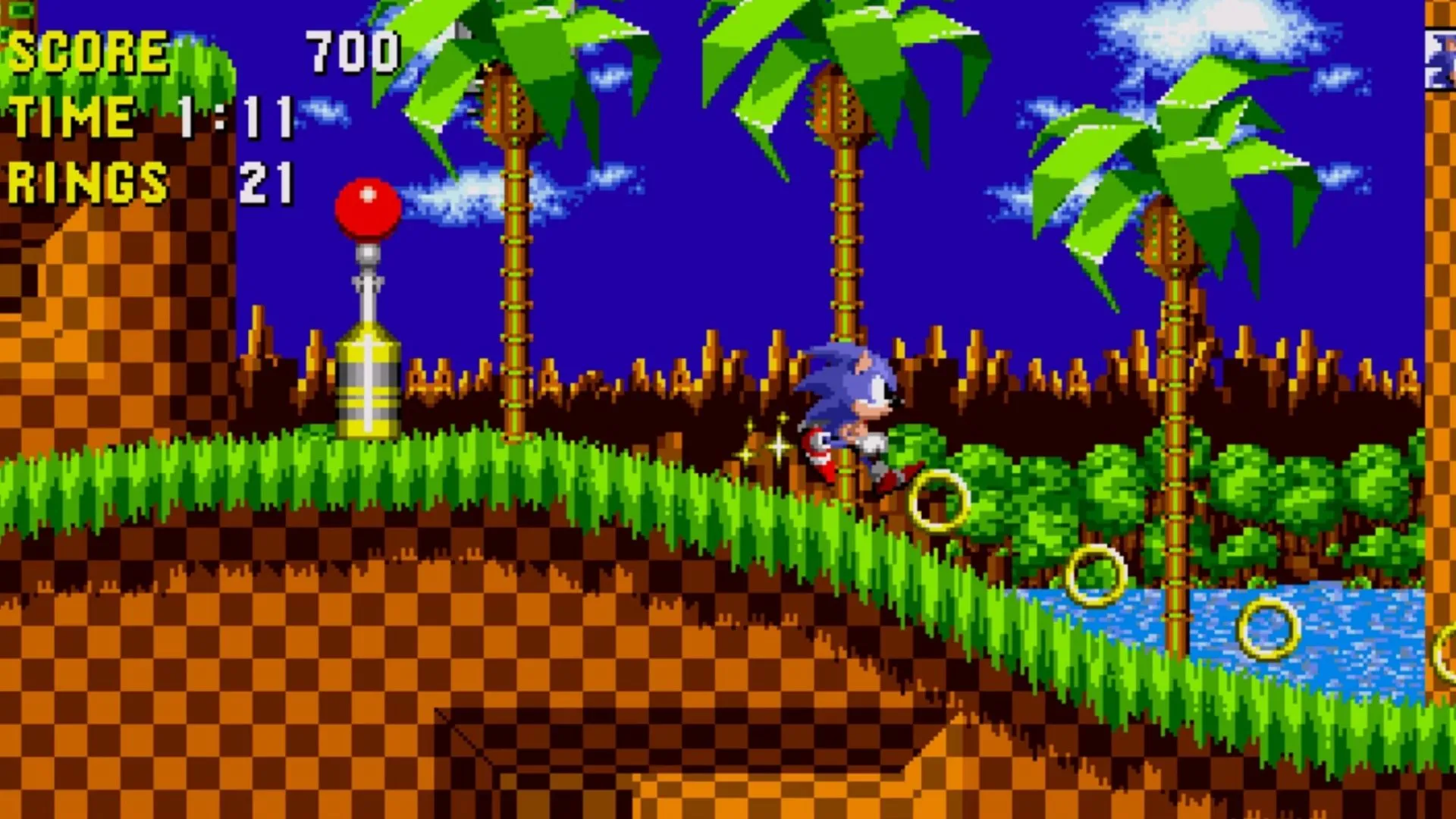 Nhân vật Sonic the Hedgehog đang chạy nhanh qua màn chơi Green Hill Zone biểu tượng