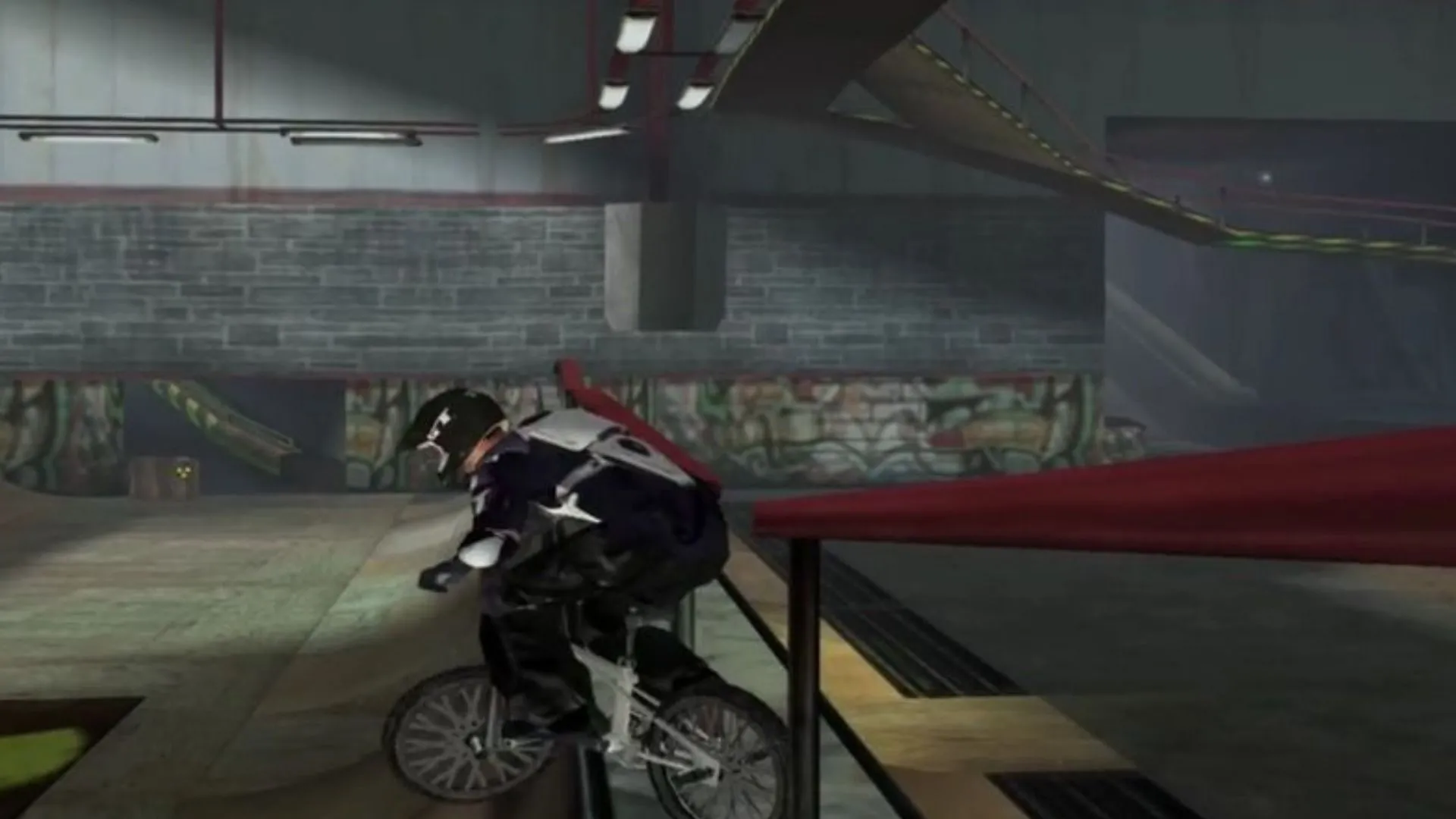 Cảnh game BMX trong Gravity Games với màu sắc nhợt nhạt và physics khó hiểu