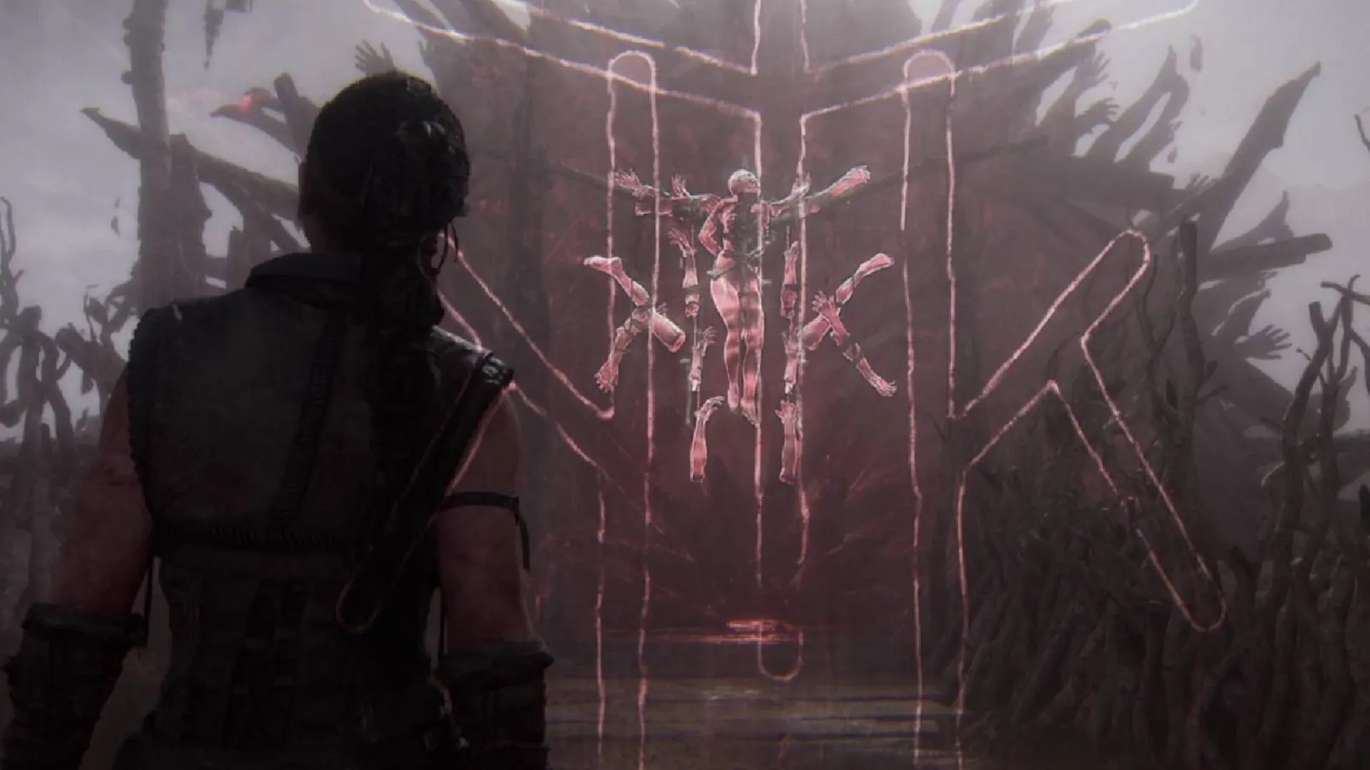 Góc chụp gương mặt Senua với ánh lửa, biểu tượng của mâu thuẫn kịch tính trong Hellblade 2